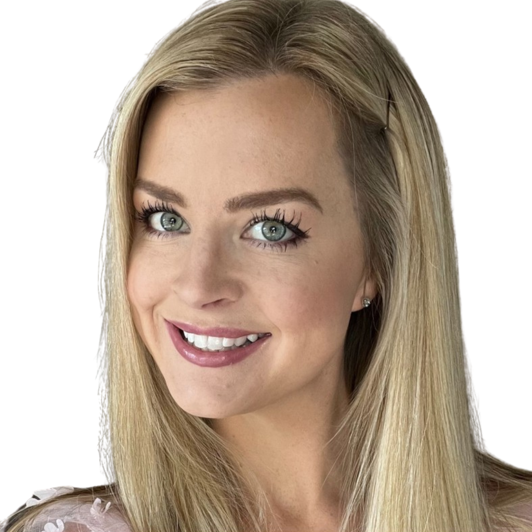 Warehouse worker standing in aisle arms crossed smiling to camera