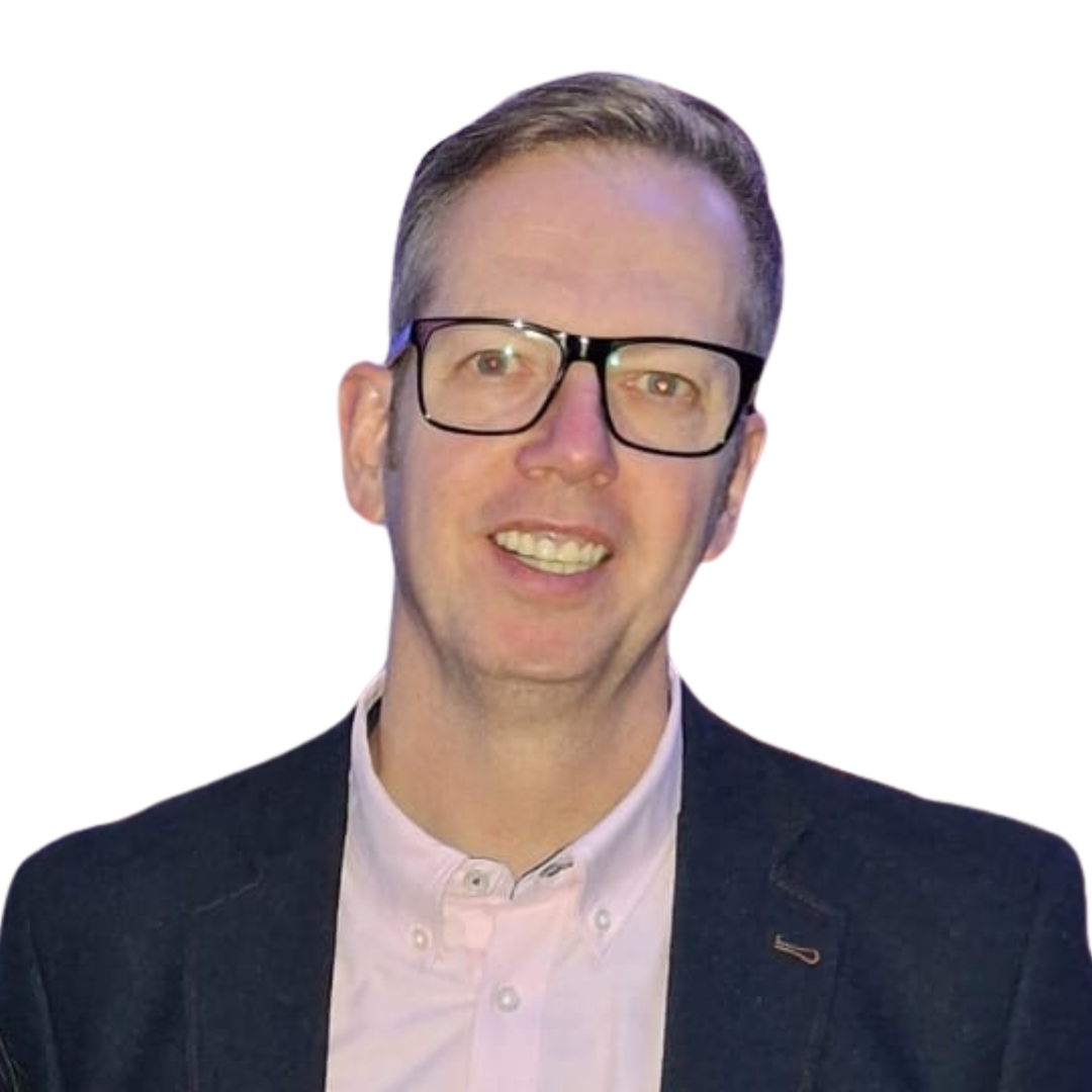 Warehouse worker standing in aisle arms crossed smiling to camera