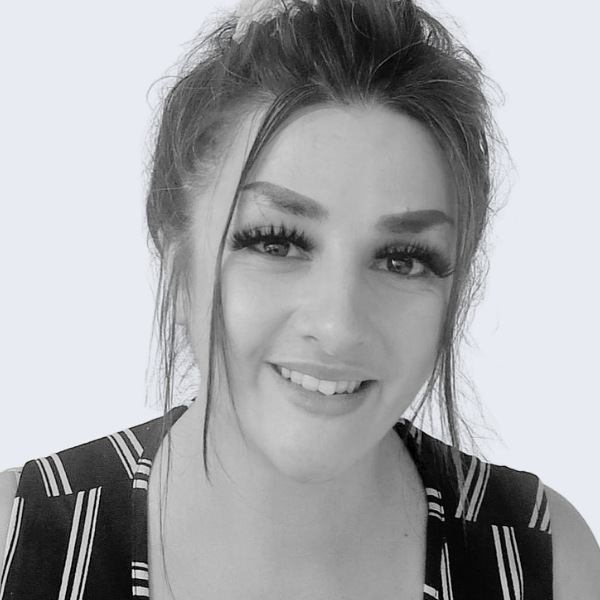 Image shows Verryan Kelly, our Branch Manager for Bridgwater and Bristol. She has dark hair, styled in a casual high bun, and is wearing a black and white striped stop. 
